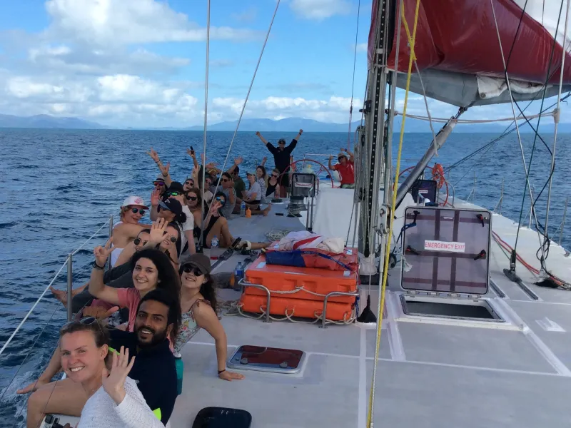 a group of people on a boat in the water