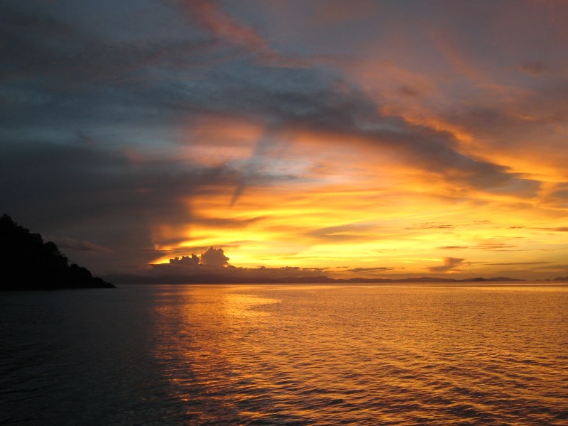a sunset over a body of water
