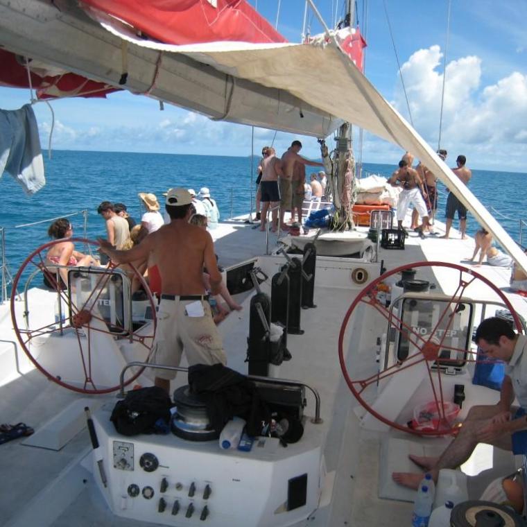a group of people in a boat on a body of water