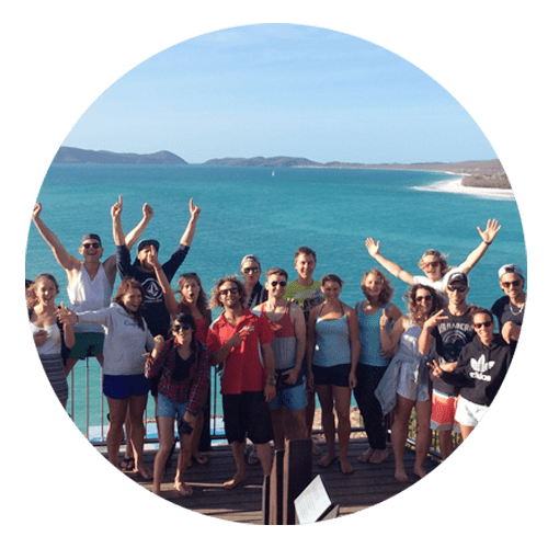 c1 a group of people standing in front of a body of water