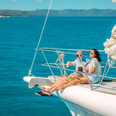 a person sitting in a boat on a body of water