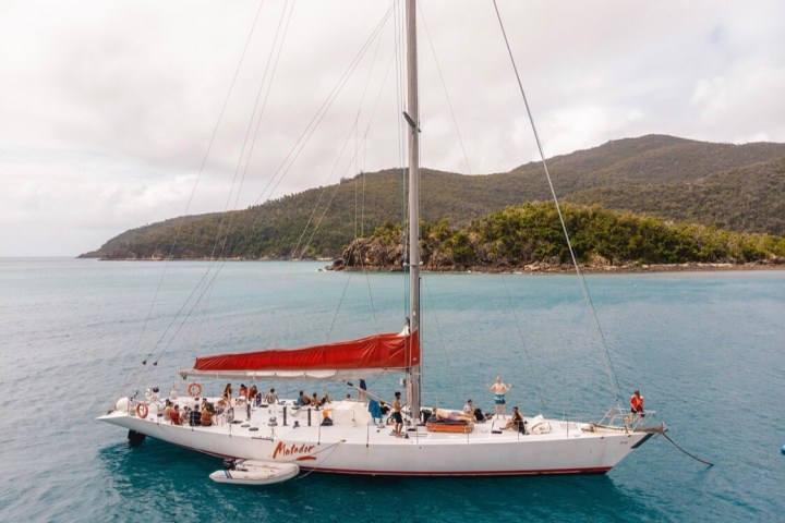 a small boat in a large body of water