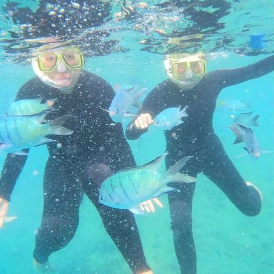a man swimming in a pool of water
