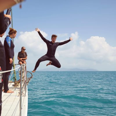a couple of people that are standing in the water