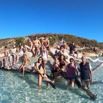 a group of people swimming in a body of water