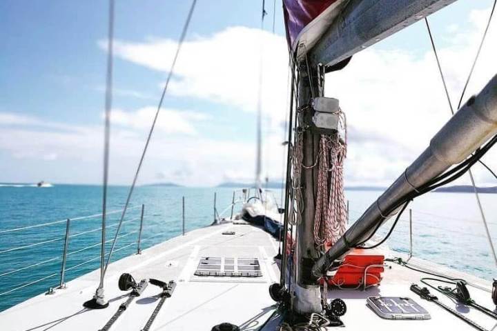 a boat is docked next to a body of water