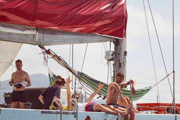a group of people on a boat in the water