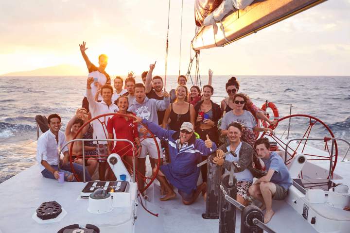 a group of people on a boat in the water