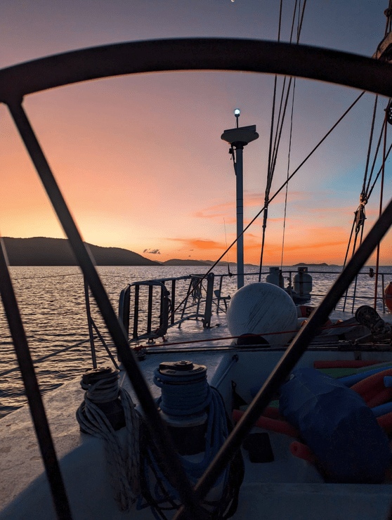 a boat is docked next to a body of water