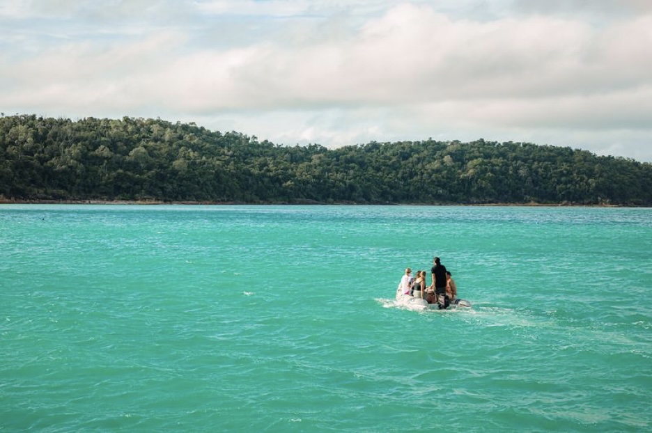 a person riding a horse in a body of water