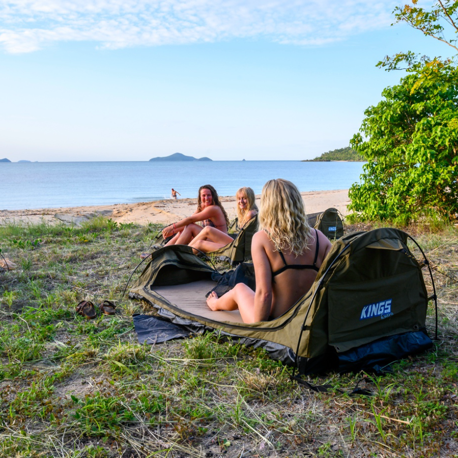 a person sitting next to a body of water